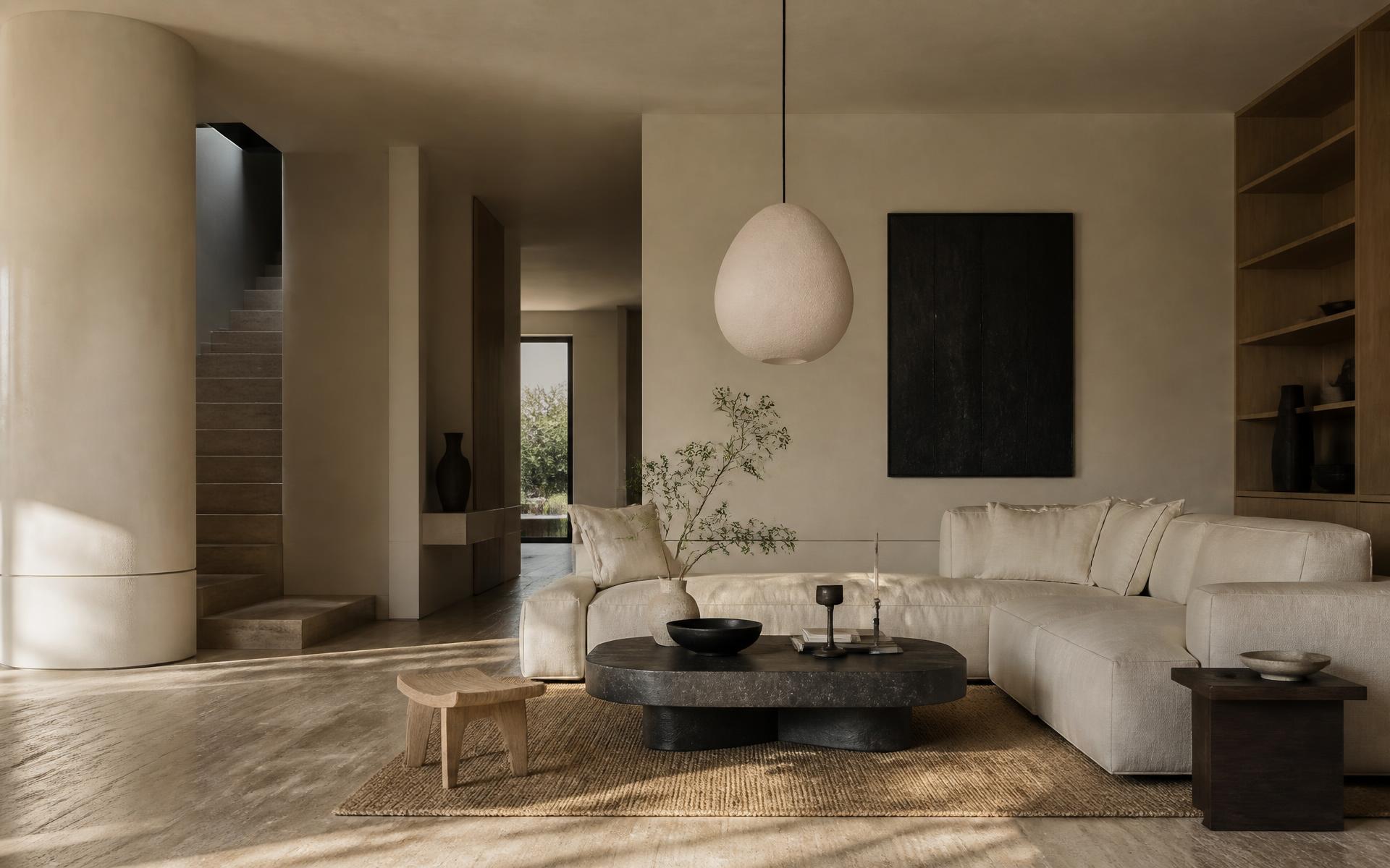 Serene luxury living space with travertine floors, plaster walls and linen upholstery