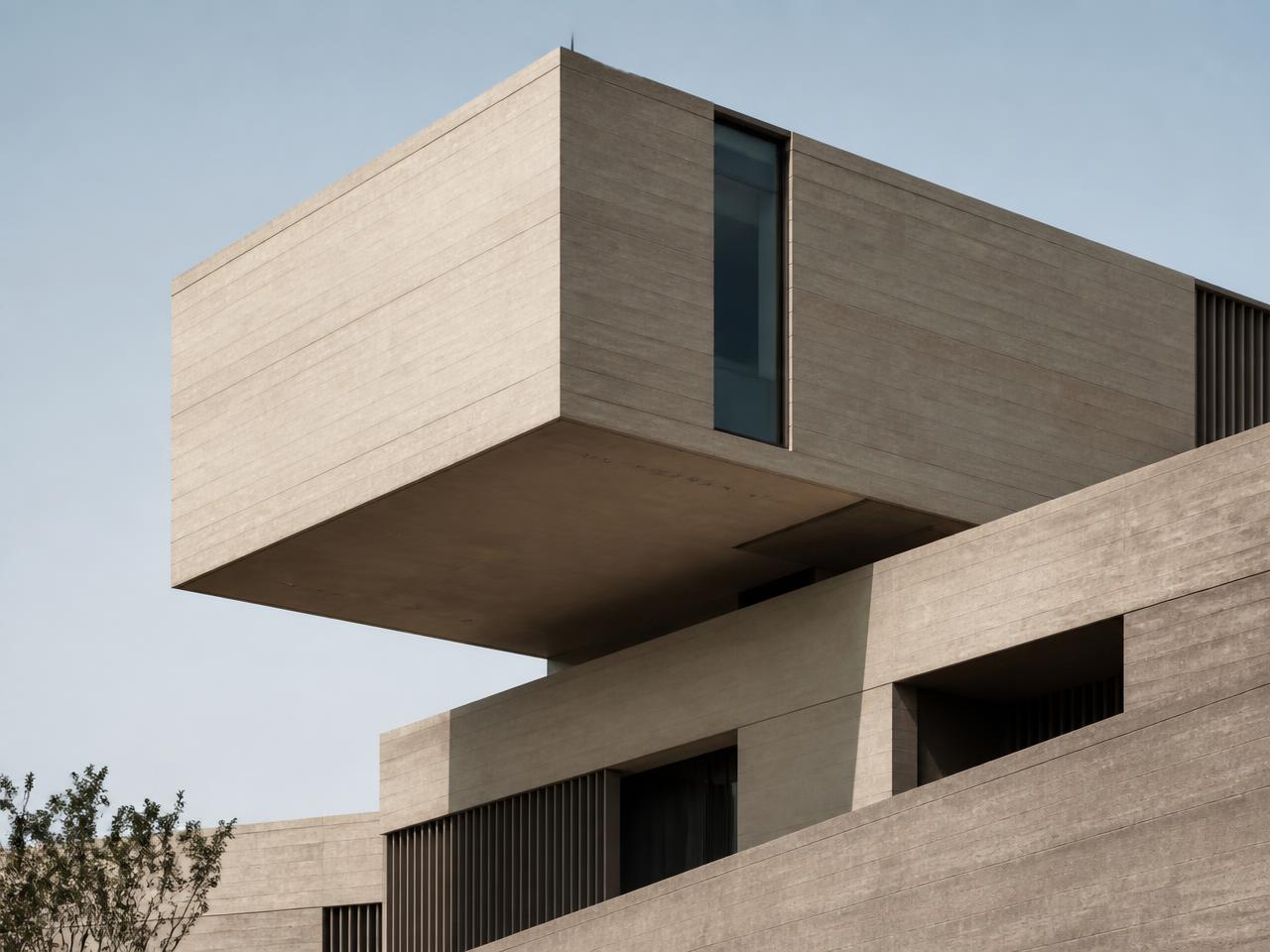 Cantilevered concrete architecture against a pale sky